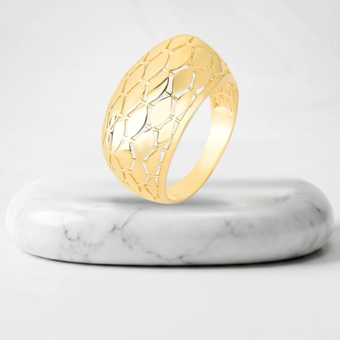 Openwork lattice ring with Bari gold plating on a marble pedestal
